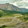 The Brazeau River runs through meadows at the base of the north side of Nigel Pass. This awesome view surprises upon rounding a bend in the trail when descending the pass.