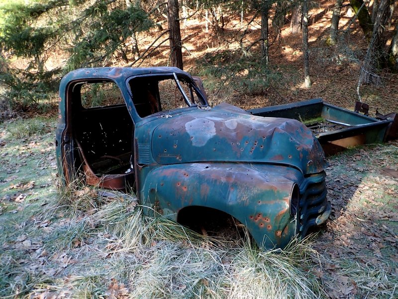 An old trucks marks the start of the singletrack trail