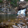 Running Eagle Falls (low flow, August) as the day turns to dusk. Near Two Medicine Lake.