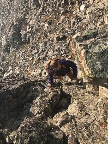 Jenna navigating the ridge on peak 1.