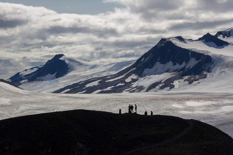 Hikers at the end of the trail, overlooking the ice field.