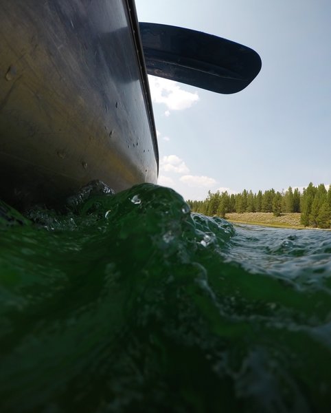 Water crashing up against the canoe.