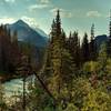 The Blaeberry River below, with rugged mountains beyond, seen looking downstream (southeast) from a high spot on the David Thompson Heritage Trail.