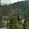 A massive waterfall along Poboktan Creek, with Waterfall Peaks looming over it in the distance, near Waterfalls Trail Camp on the Poboktan Pass Trail.