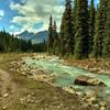 Calumet Creek. The trail runs along the creek after crossing the large open, flat, wet meadow to the west.