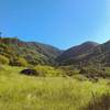 The Guayabal river runs through this beautiful mountains that occasionally open just enough to create small valleys