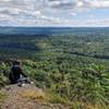 Contemplating the meaning of life (or perhaps it is just thinking on a great breakfast sandwich) along Cliff Trail.