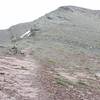 The trail is marked by cairns as it climbs up the side of the mountain.