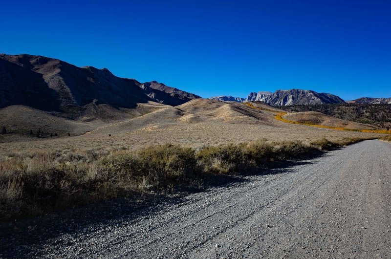 Laurel Lakes Road can be seen winding up the hillside as viewed from Sherwin Creek Road.