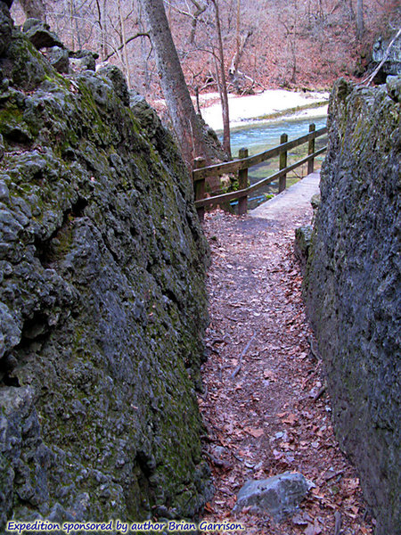 On the Ha Ha Tonka Spring Trail, where it passes through fractured limestone with the spring creek in the background.  About: 37.973762, -92.767618