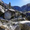 The trail winds through a large rockfall area on the way up the valley.