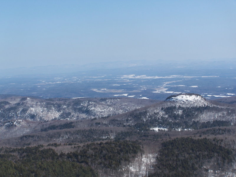 Sugar Loaf and Drowned Lands at Black Mountain. Sugarloaf is that little peak in the foreground. Drowned Lands, the lower portion of Lake Champlain can be seen in the background.