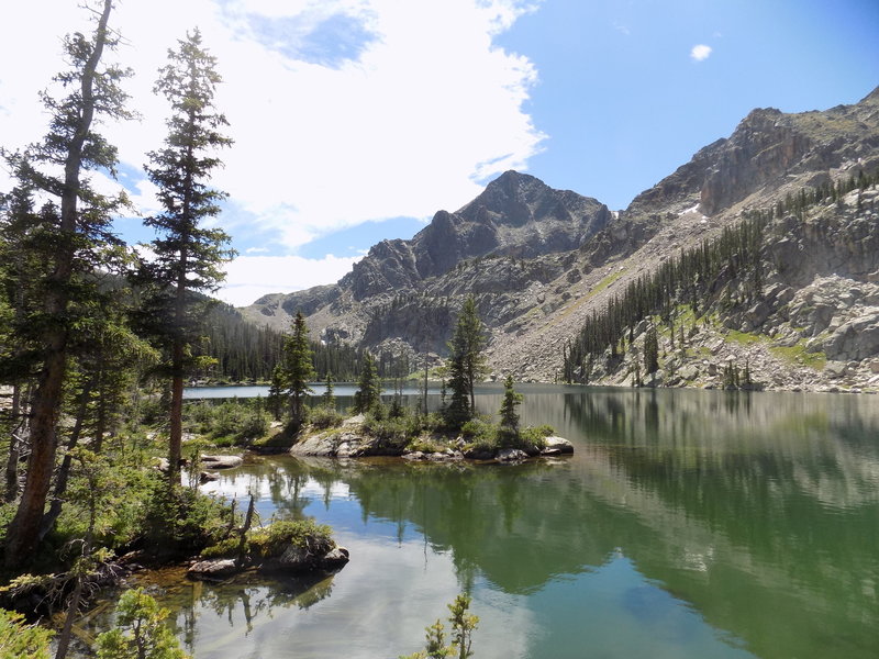 Andrews Peak reflects in Lake Nanita.