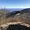 View from overlook at 0.21-mile mark looking back at trailhead parking lot.