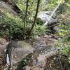 I believe that this might be some of an upper part of an earlier fall seen from across Oil Camp Creek. It is a slippery crossing (especially with a pack) and not the only one along this trail but this one had a hand cable to hold onto so no problems.