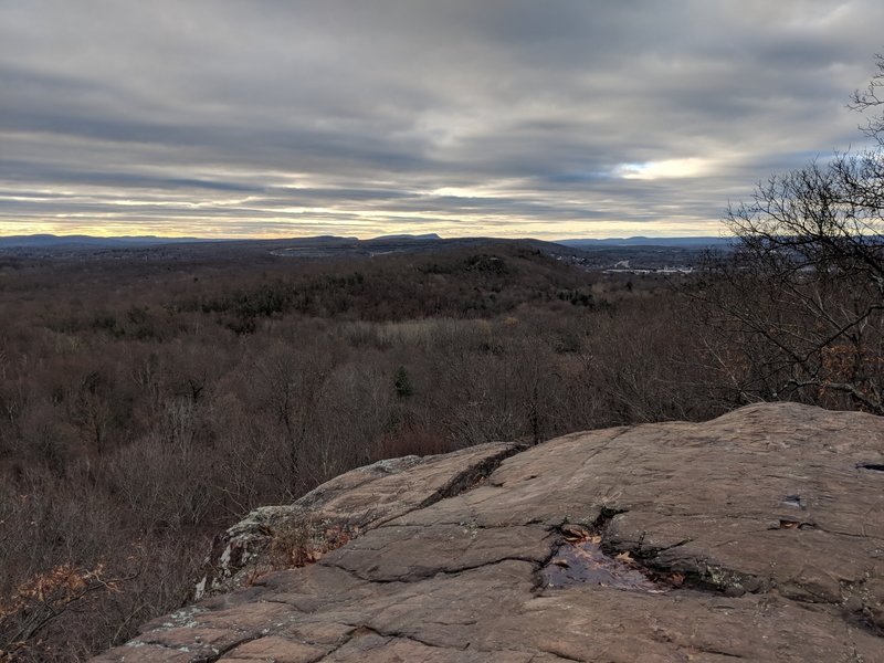 Cliff and outlook toward Ragged Mt.