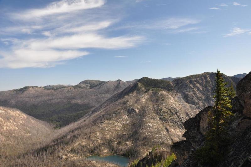 Dawn lake and valley showing burn