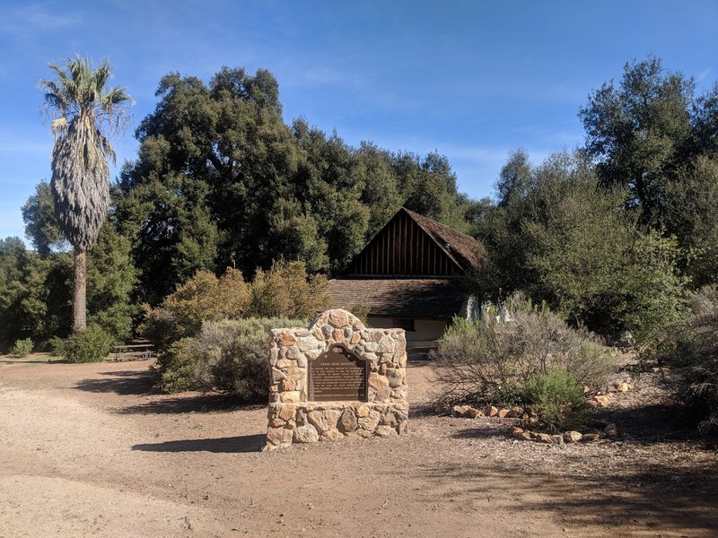 The entrance to the Moreno adobe from the trailhead. One of the many picnic tables can be seen in the background.