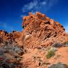 Colorful rock formations (with keyhole) along the wash