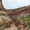 Large boulders make navigating through Lower Muley Twist Canyon an adventure.