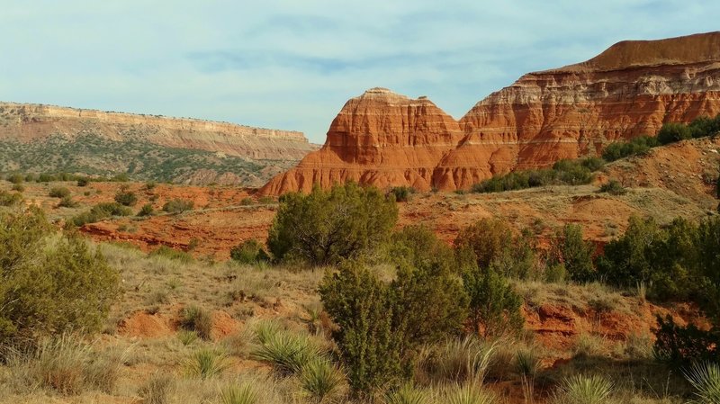 Left to right - Fortress Cliff in the distance across Prarie Dog Town Fork of the Red River, west faces of Capitol Peak, and Capitol Mesa, looking east along Lighthouse Trail.