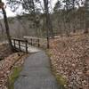 A couple wooden bridges that span gaps in the rocks.