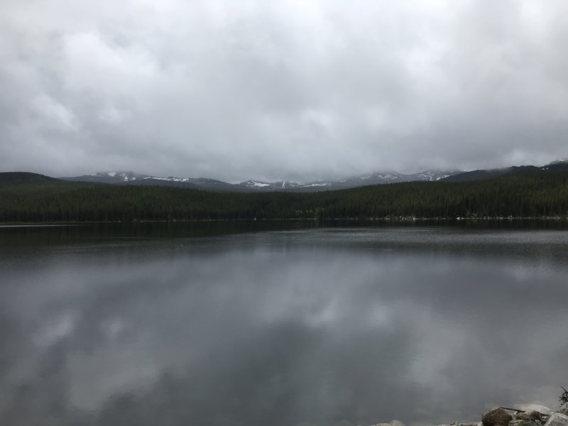 Cloudy, mountain view behind lake