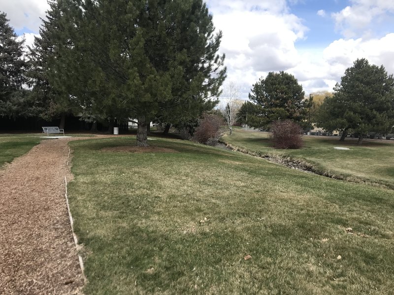 The soft mulch trail runs alongside a canal and through a disc golf course as well.