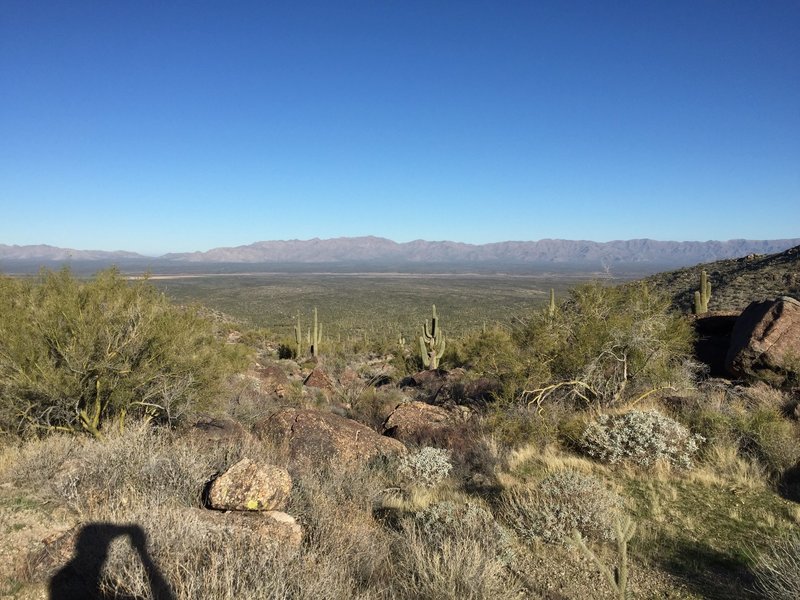 View back (north) to the trailhead from the saddle.