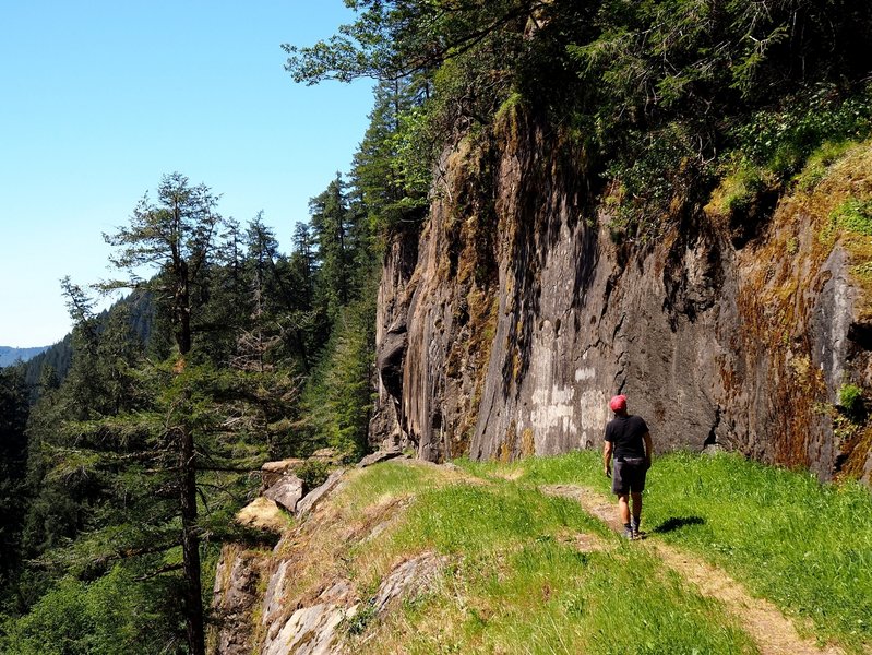 The trail traverses a steep drop just before the top of the falls