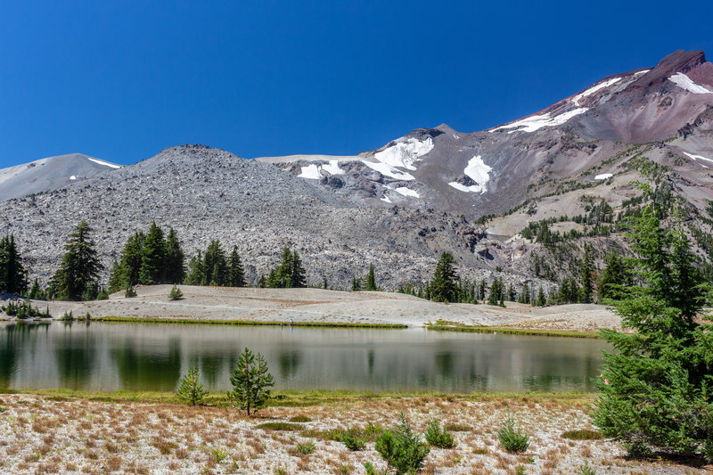 Green Lakes and South Sister covered in patchy snow.