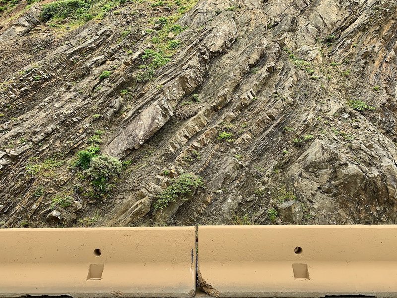 The trail is named for a feature of geology: the shale and sandstone are slipping into the Pacific. Sturdy barriers protect the road without inhibiting views.