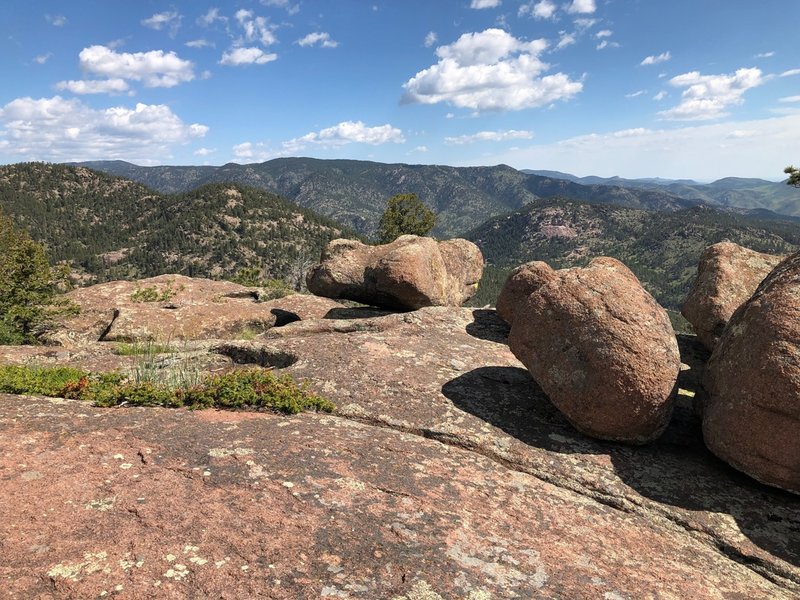 How did those big boulders end up balanced on top of these cliffs?