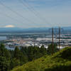 Rainier, Helens, and Adams from the BPA Road Trail, along with the confluence of the Willamette and Columbia Rivers. The power lines are ugly but the views make up for it