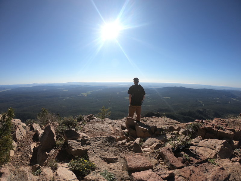 Enjoying the views at the edge of Hermit's Peak.