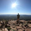 Enjoying the views at the edge of Hermit's Peak.