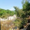 A brief break in the trees offers an overlook of the East Branch Pemigewasset River. Watch for eroding banks.