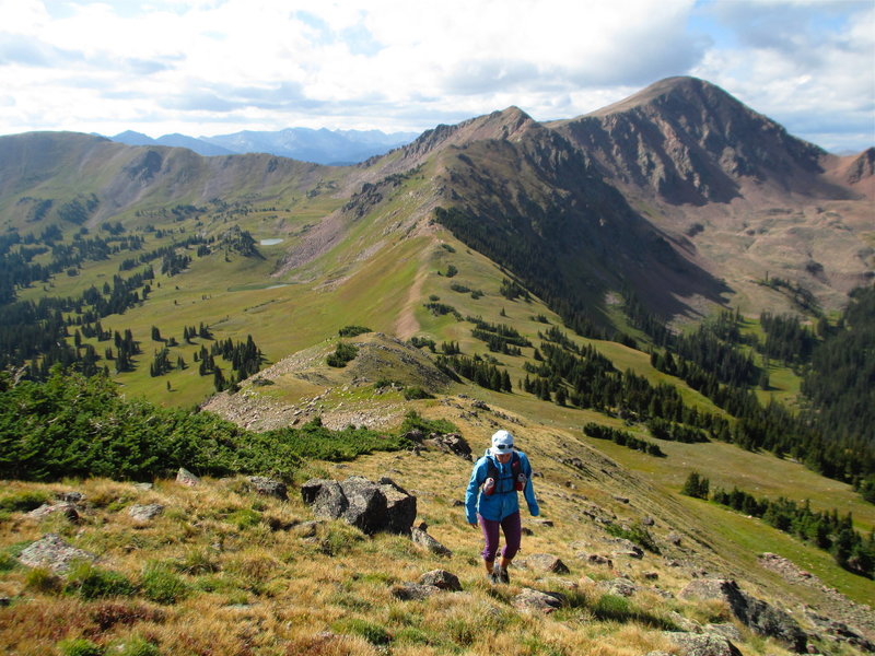 Amy "runs" the ridge toward Red Peak. Red Buffalo Pass is below with Eccles Pass beyond.