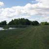 The trail is essentially a mowed path along the river as it heads toward the bottom lands where trees grow in abundance.