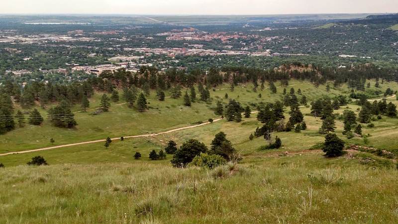 A view of the Dakota Ridge Trail and the wider Sanitas Valley Trail, as seen from the East Ridge Trail partway up Mt Sanitas.