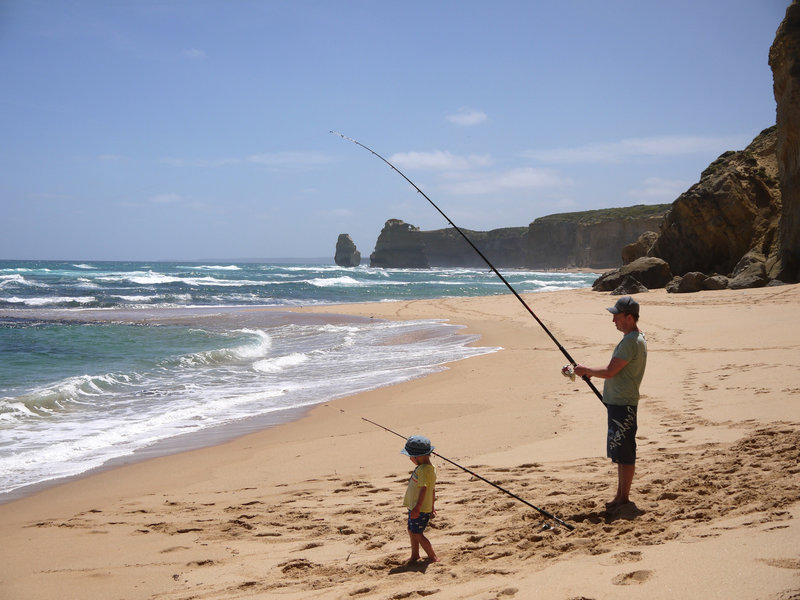 Father and son fishing at Gibson Beach well away from the tourists