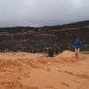 Hiker caught in a late spring hail storm at Coral Pink Sand Dunes SP