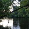 Looking across Huron River towards Huron Towers Apartments.