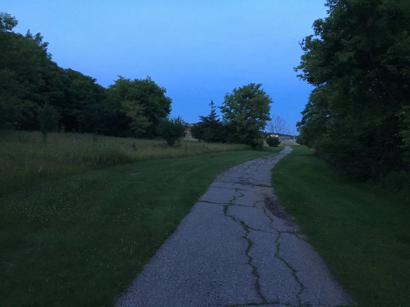 Path along Fuller Road approaching Huron High School.