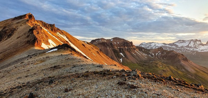 Top of Gagnheiði at midnight in summer. Staðarfjall in right side midground and Dyrfjöll in right side background.