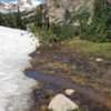 Huge snowpacks blocking the trail, even in late July. Able to walk on top to get the lake shore, but very slippery. We did not make it to the furthest side of the lake due to snow.