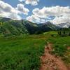 Crossing the meadows of Capitol Ditch Trail