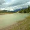 A side channel of the Athabasca River rounds a bend to join the main channel, looking north from Athabasca River Trail.