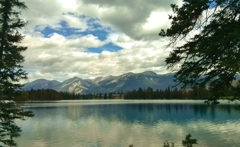 Lac Beauvert. Jasper Park Lodge, established in 1922, is on the opposite shore (center).