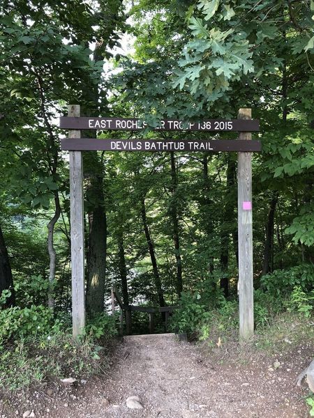 The trailhead to Devil's Bathtub, which is at the top of a staircase leading down into the basin.